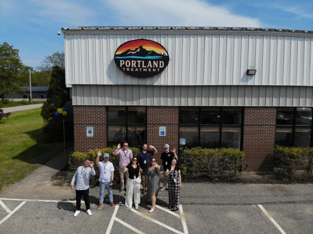 The Portland Treatment team waving outside their Biddeford, Maine outpatient center