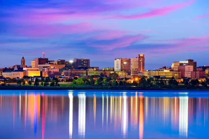 The Portland, Maine skyline at dusk from across Casco Bay