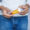 young man hand holding medicine orange and white color pill container