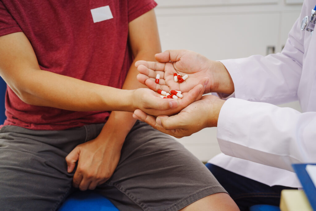 A man consults a doctor in a hospital