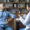 African american woman doctor showing young black patient jar with pills drugs