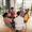 Diverse group of people sitting in circle in group therapy session.