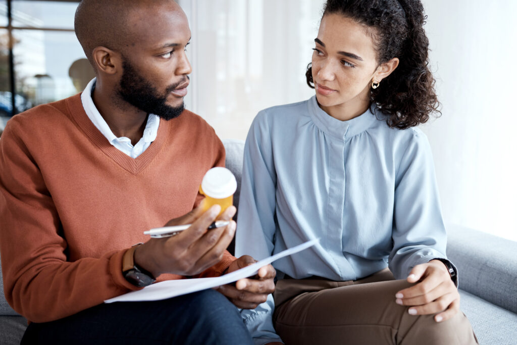 Therapy, mental health and pills for woman with depression, trauma or stress with psychologist. Per.