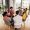 Diverse group of people sitting in circle in group therapy session.