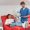 redhead doctor in blue uniform and latex gloves using digital tablet near transfusion machine and multiracial woman with pressure cuff sitting on medical chair in clinic